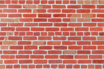 Red brick wall with red blocks. Brick wall texture background.