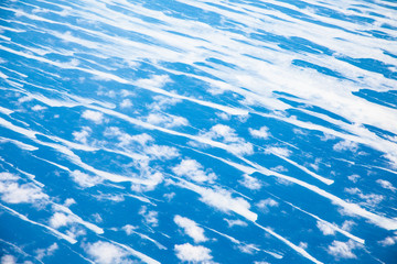 aerial of puffy clouds at the pacific ocean