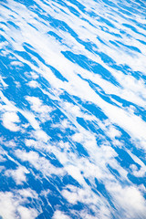 aerial of puffy clouds at the pacific ocean