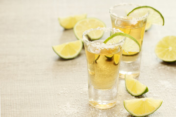 Tequila shots with sliced lime