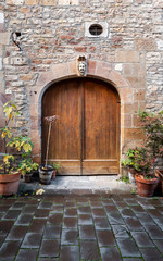Beautiful wooden door and an old stone building