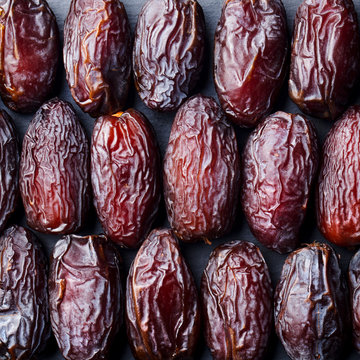 Fresh Medjool Dates background. Healthy organic product. Top view.