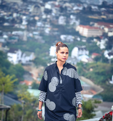 Woman overlooking the city view, Dalat, Vietnam