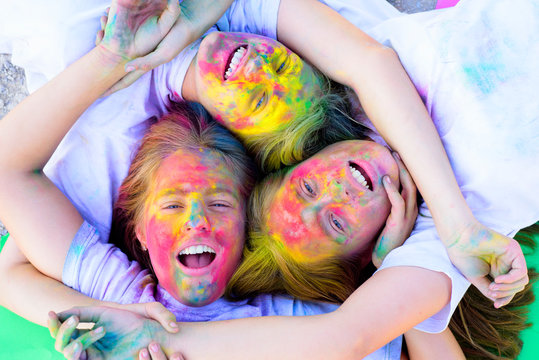 unite. Crazy hipster girls. Summer weather. Happy youth party. Optimist. Spring vibes. positive and cheerful. children with creative body art. colorful neon paint makeup. friendship and sisterhood