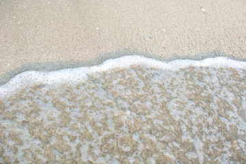 Sea waves on the sand beach