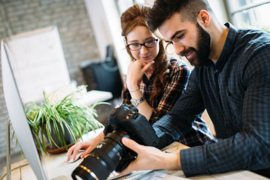 Two young designers working in modern office