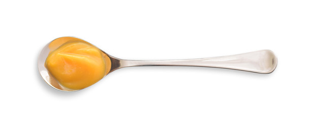 Zabaione cream in spoon flat lay closed up isolated on white