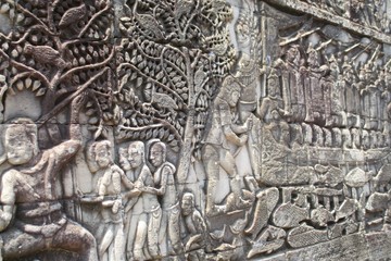 Fototapeta na wymiar Cambodia Angkor Bayon bas-relief. Outer gallery of Bayon showing a series of bas-relief depicting historical events and daily lives of Angkorian of that time.