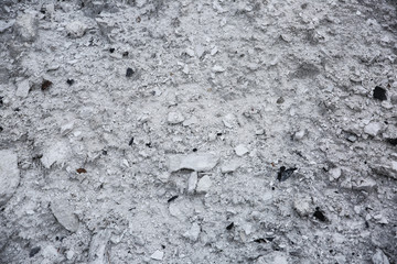 Grey sand background. Texture of ground.
