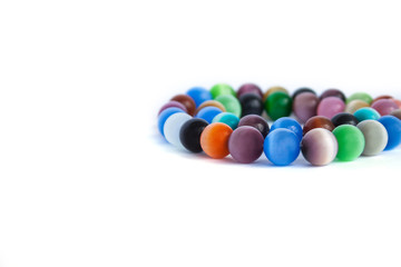 Cat's eye quartz necklace and bracelet, selective focus on white background isolated. Colourful precious stones.