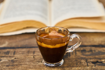 Dark espresso coffee and book