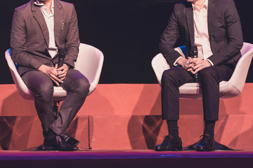 speakers on the stage in the conference hall or seminar meeting, business and education concept