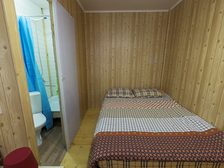 budget guest house interior: bed, bed, bathroom