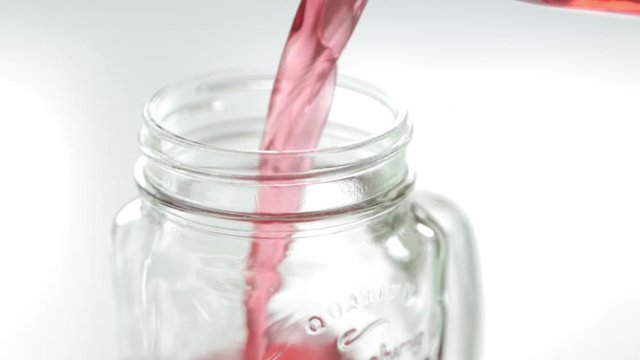 Adding berries and ice to carbonated water. Step by step preparation of cocktails with lemon and orange.