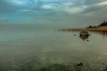 A mystical landscape of Ohrid Lake in the early morning.