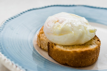 Poached Egg on Toast Bread for Breakfast.