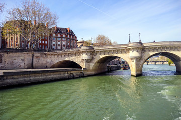 Naklejka premium The oldest standing bridge ( Pont Neuf ) across the River Seine in Paris France. April 2019