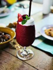 A glass of mixed berries yogurt smoothie.