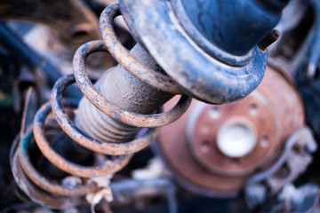 Parts of used cars sitting in junkyard