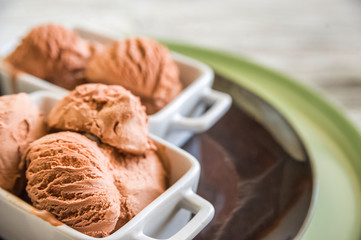Chocolate ice cream balls close up and copy space