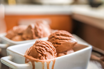 Chocolate ice cream balls close up and copy space