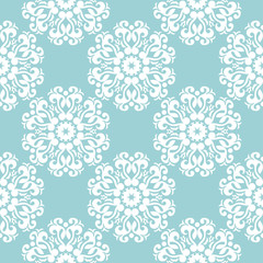 White floral design on blue seamless background