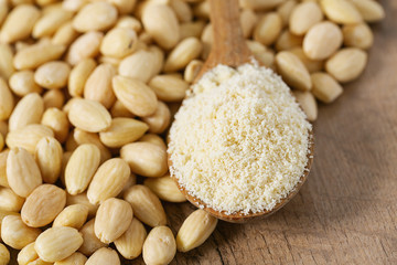 almond flour in a wooden spoon
