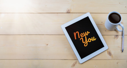 New you text on tablet on work table