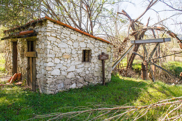 Fototapeta na wymiar old water mill at the spring