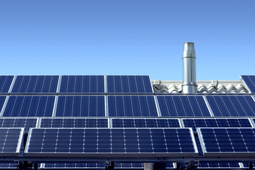Photovoltaic plant with stainless steel exhaust pipe on a roof