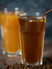 Two iced coffees . Summer cold coffee with milk and ice.