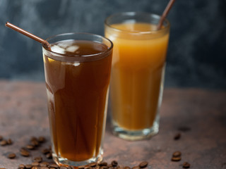 Two iced coffees . Summer cold coffee with milk and ice.
