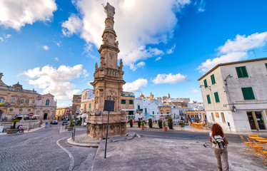 POLIGNANO A MARE, ITALY - SEPTEMBER 16, 2014: Tourists visit the city on a beautiful summer day. The city is a famous tourist attraction in Apulia