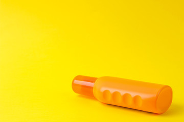 sunscreen remedy. various sunscreens on a bright yellow background. Sun protection. Ultraviolet protection. Summer. Vacation space for text