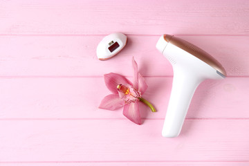 A set of different hair removal products on a wooden table. Removal of unwanted body hair at home.