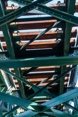 a view on the metal railroad bridge from beneath