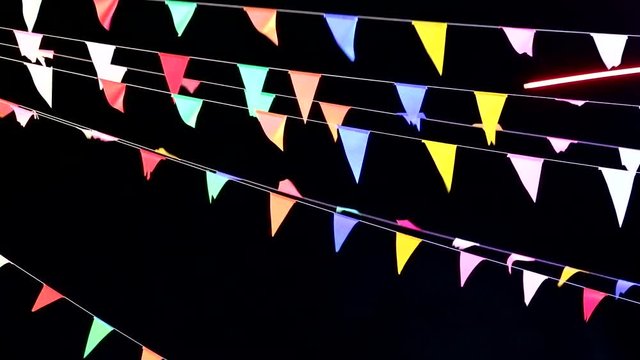 colorful triangular flag line moving by wind and smoking