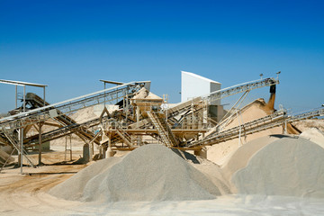Rock crusher with conveyor belts at a gravel, Lleida, Catalonia, Spain.