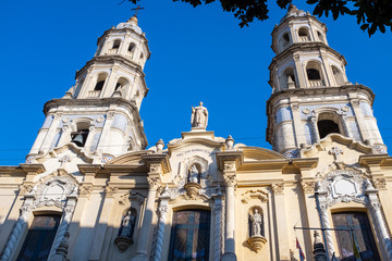Close up of the front of a church in San Telmo, Buenos Aires, Argentina against a bright blue sky