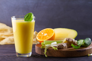 Orange Mango Ginger Smoothie. Fruit and Vegetable Smoothie - healthy diet and detox drink. Room for text, copy space