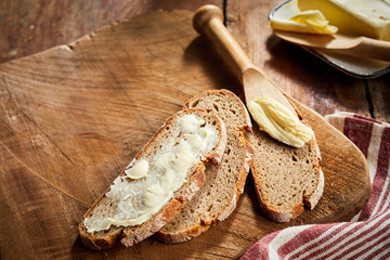 Buttered rye bread with butter spreader