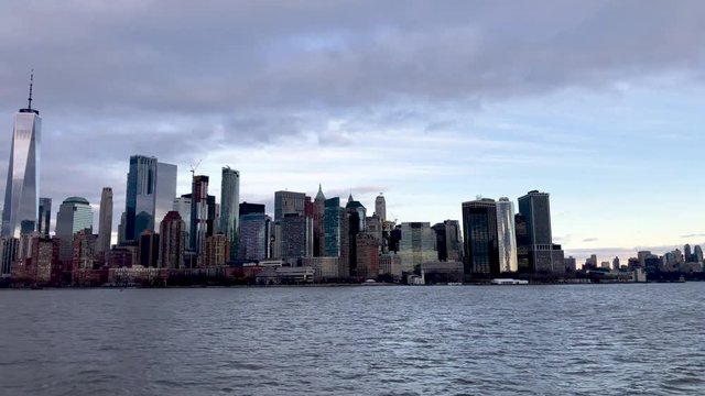 Downtown Manhattan panoramic skyline from moving ship, New York