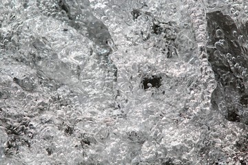 Air bubbles in fast flowing water stream
