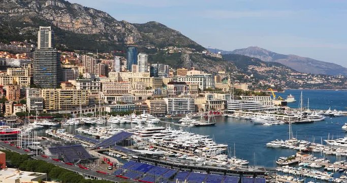 From the top counterclockwise panoramic view from the bay of Monaco and the rostrum for the Formula One race championship to the buildings