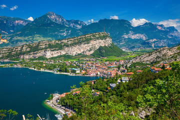 Garda Lake with mountains and small village Torbole