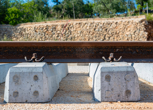Rails, sleepers and mounting nuts close up
