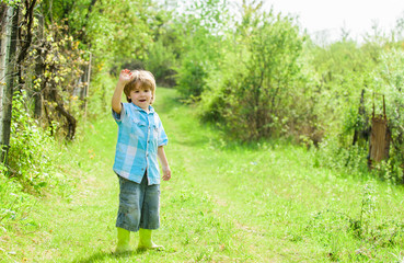 human and nature. earth day. Eco life. summer activity. small kid gardener walking in forest....