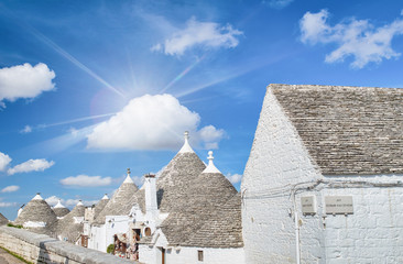 Alberobello, Apulia - Italy. Beatiful view of Trulli against a blue summer sky