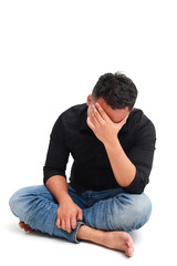 Depressed young asian man suffering from headache, isolated on white background.