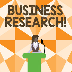 Word writing text Business Research. Business photo showcasing process of acquiring detailed information of the business Businesswoman Standing Behind Podium Rostrum Speaking on Wireless Microphone